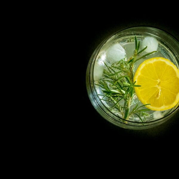 yellow lemon in clear drinking glass