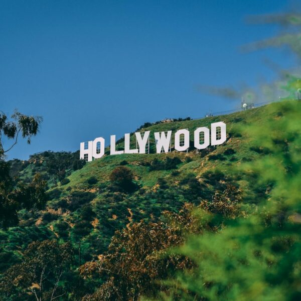 A scenic view of the famous Hollywood sign on a sunny day in Los Angeles.