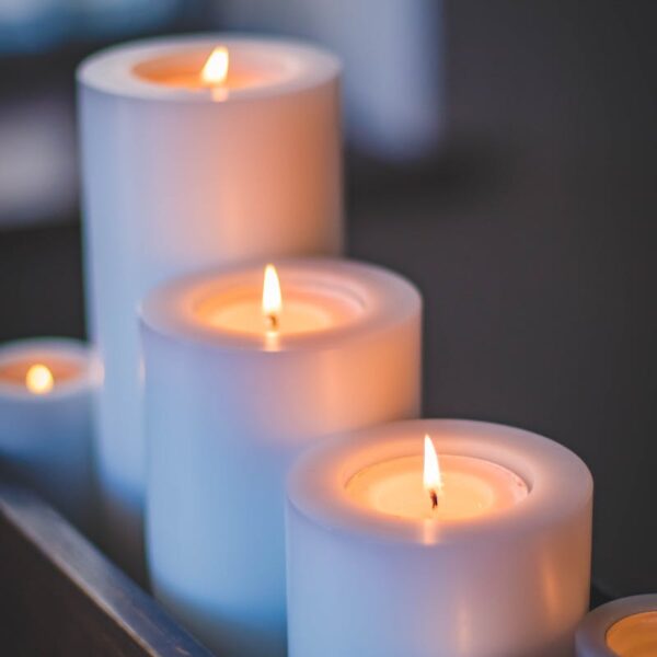 A close-up of a serene candlelight arrangement with a soft, soothing glow.