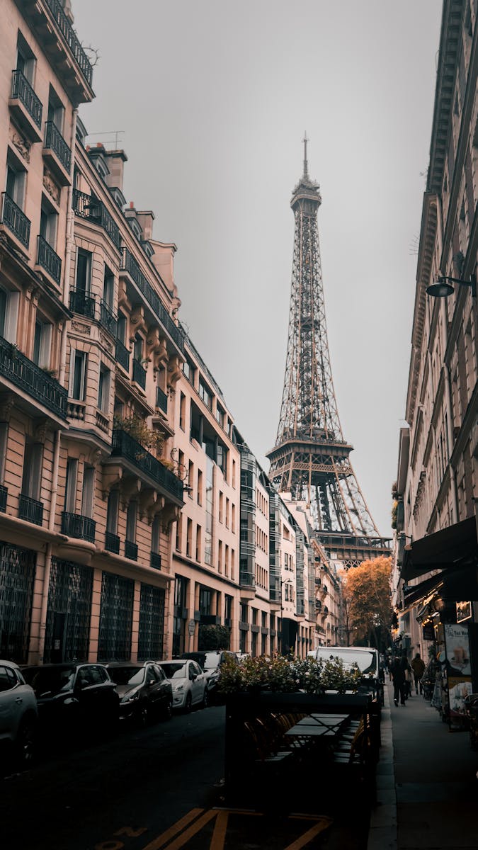 Captivating street view of the Eiffel Tower in Paris, showcasing classic architecture.