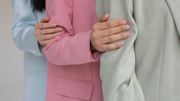 Elegant studio portrait showcasing diverse women in pastel blazers, highlighting modern fashion.