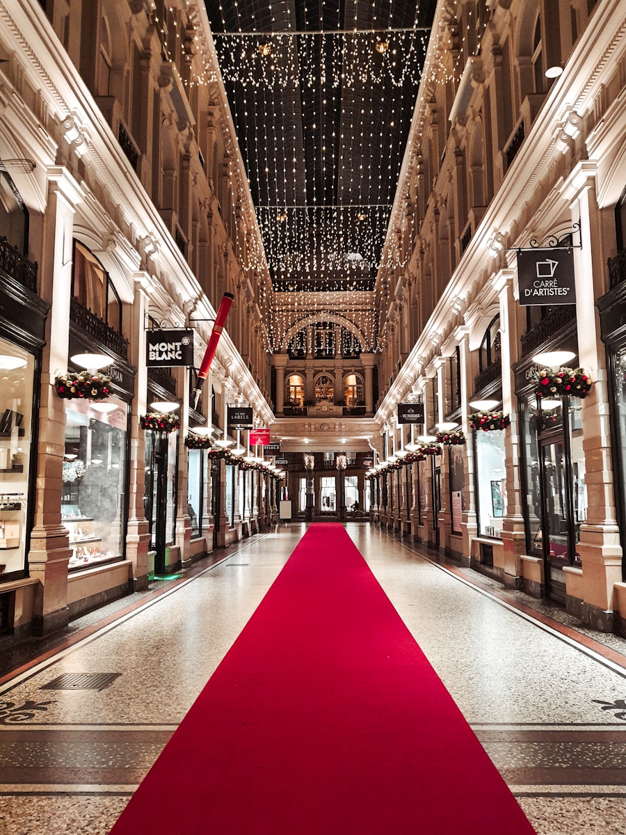 a red carpet is on the floor of a shopping mall