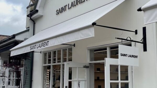 Chic Saint Laurent store entrance showcasing modern architecture and style.