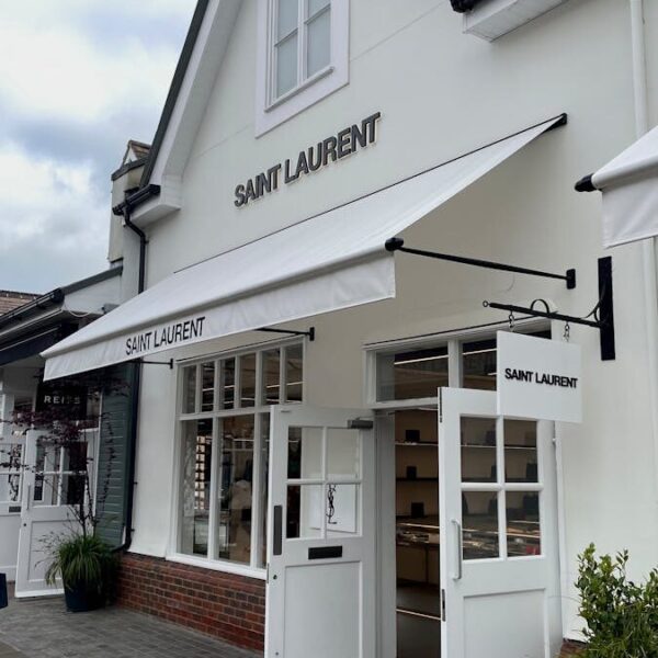 Chic Saint Laurent store entrance showcasing modern architecture and style.