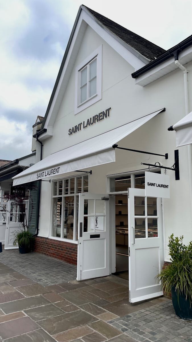 Chic Saint Laurent store entrance showcasing modern architecture and style.