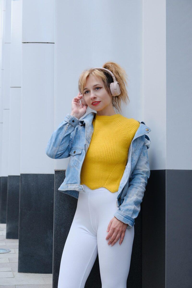 woman, headphones, music, modern, street, white leggings, city, fashion, style, jean jacket, ponytail hairstyle, columns