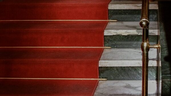 red concrete staircase with stainless steel railings