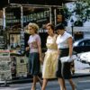 three women walking on road