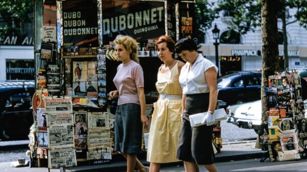 three women walking on road