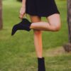 woman in black boots