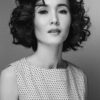 a woman with curly hair