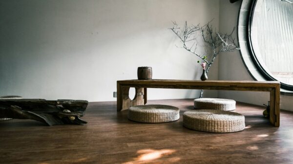 brown wooden bench near window