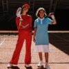 Two athletes in vibrant sport wear posing confidently on a tennis court.