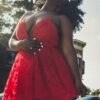 woman in red spaghetti strap dress