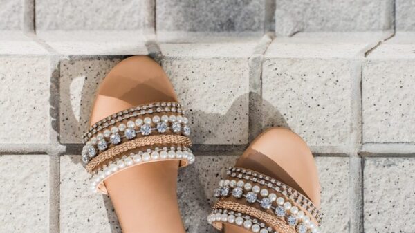 woman in orange and brown leather open toe sandals
