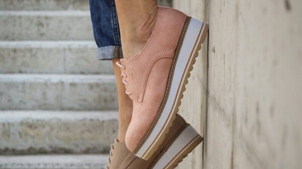 person wearing brown loafers