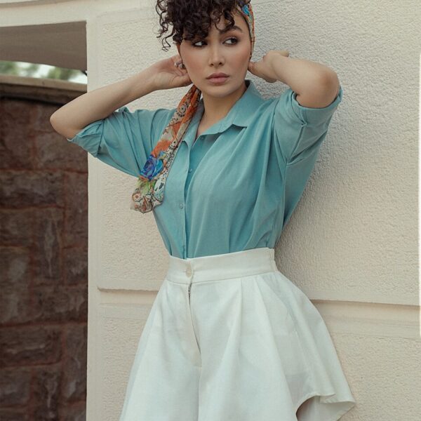 a young girl in a blue dress