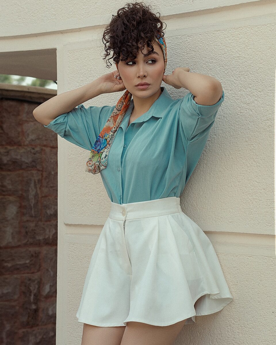 a young girl in a blue dress