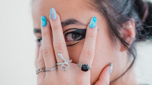 a woman holding her hands to her face
