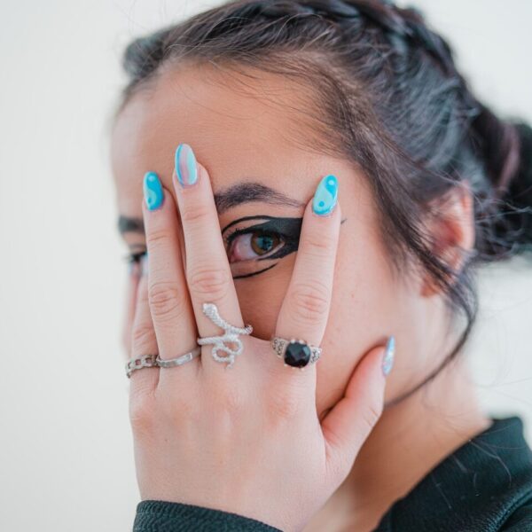 a woman holding her hands to her face