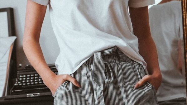 woman in white crew neck t-shirt and black and white striped skirt