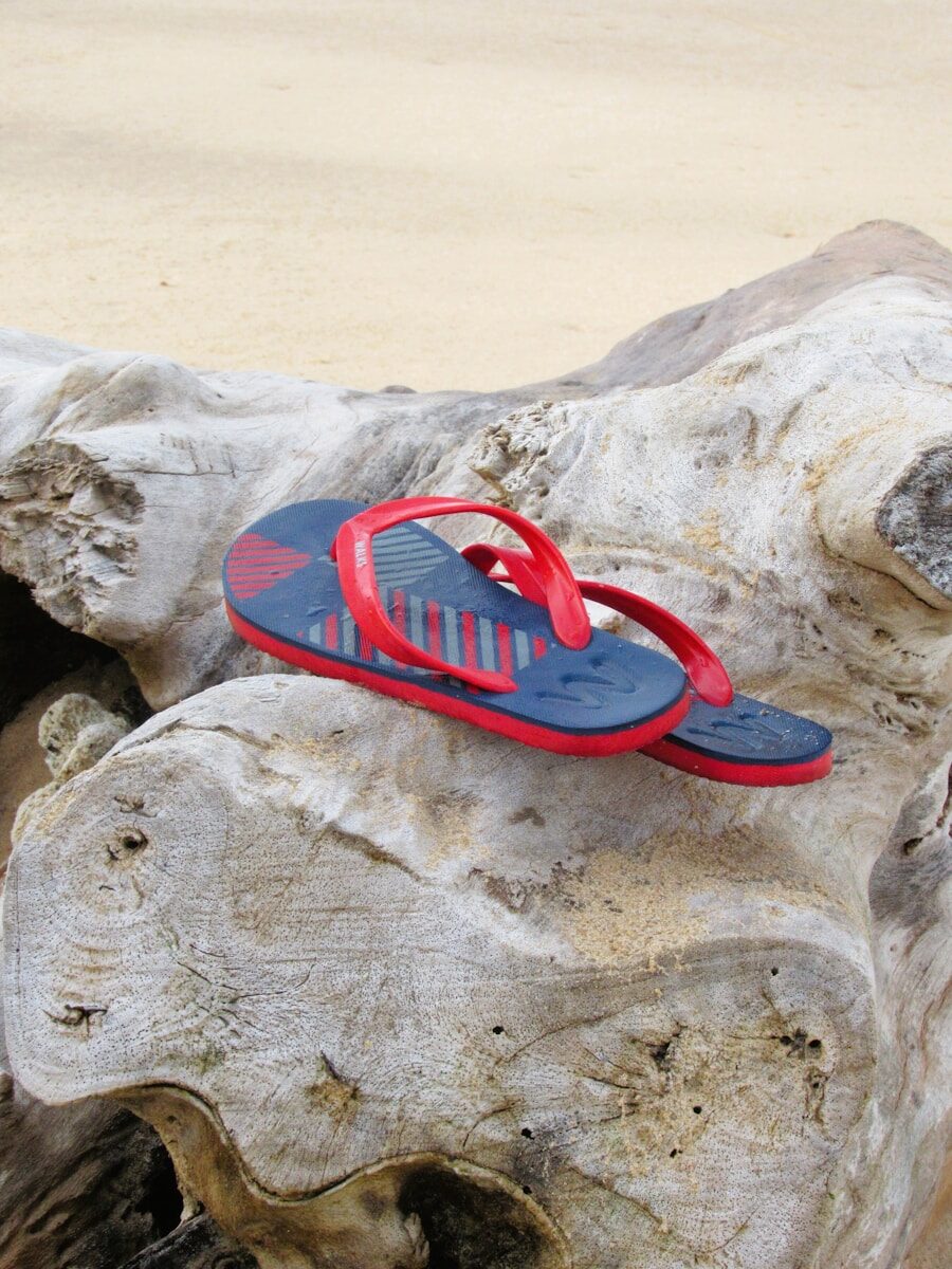 a pair of sandals on a rock