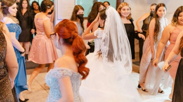 Bride dances with friends at a celebration.