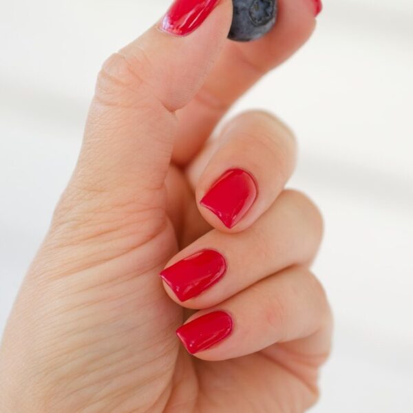 a hand with painted fingernails