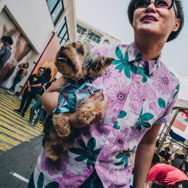 woman walking whiled holding puppy