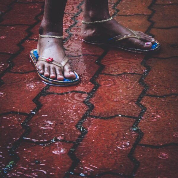 person wearing black leather peep toe heeled shoes