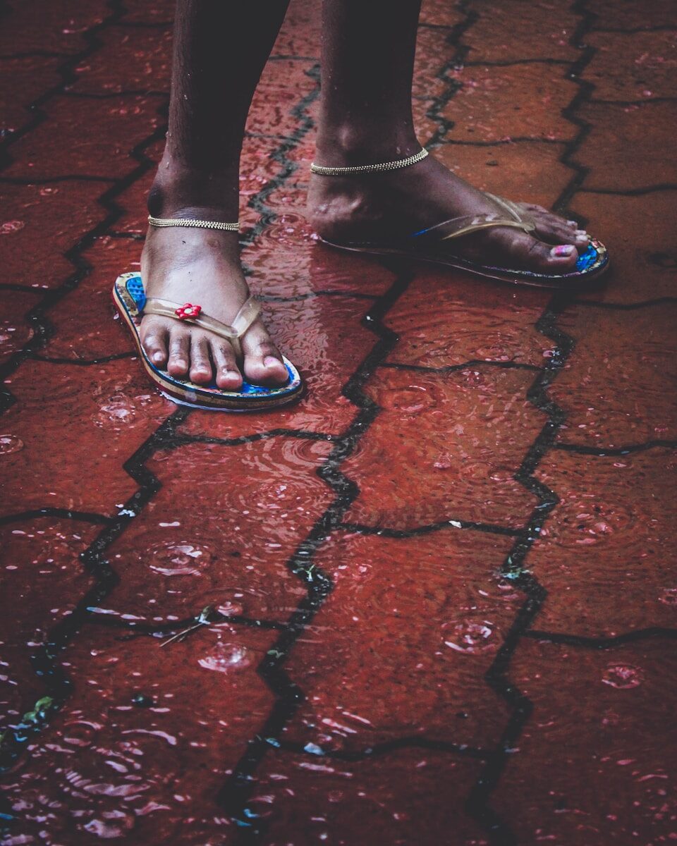 person wearing black leather peep toe heeled shoes