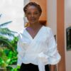 woman in white dress shirt and black skirt