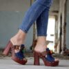 woman wearing brown chunky-heeled sandals