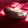 white and red flats on red textile