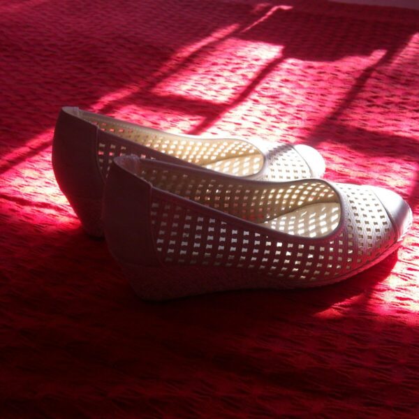 white and red flats on red textile