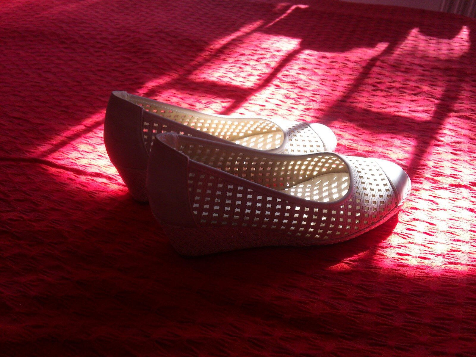 white and red flats on red textile
