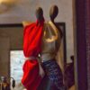 a mannequin with a red scarf wrapped around it