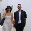 A man and a woman walking down a street