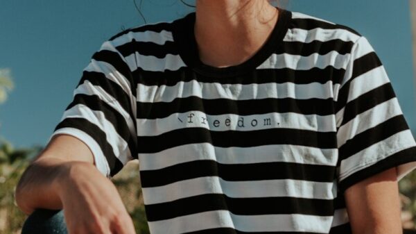 shallow focus photo of woman in white and black striped crew-neck T-shirt