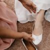 woman in white dress and white peep toe pumps