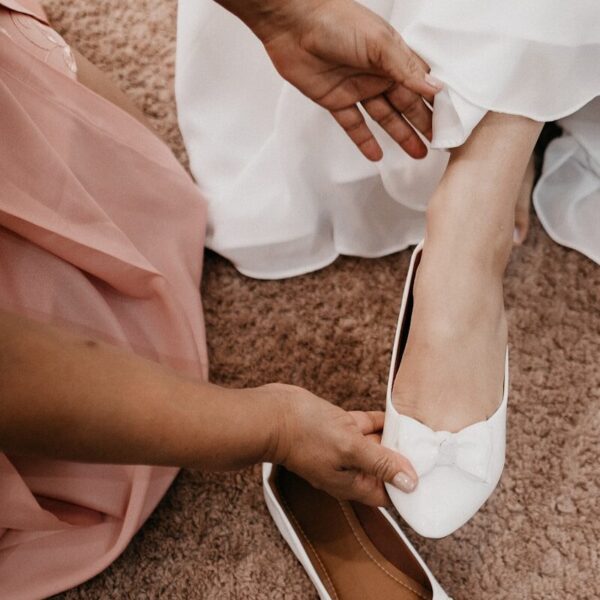 woman in white dress and white peep toe pumps