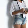 woman in white button up shirt and blue denim shorts